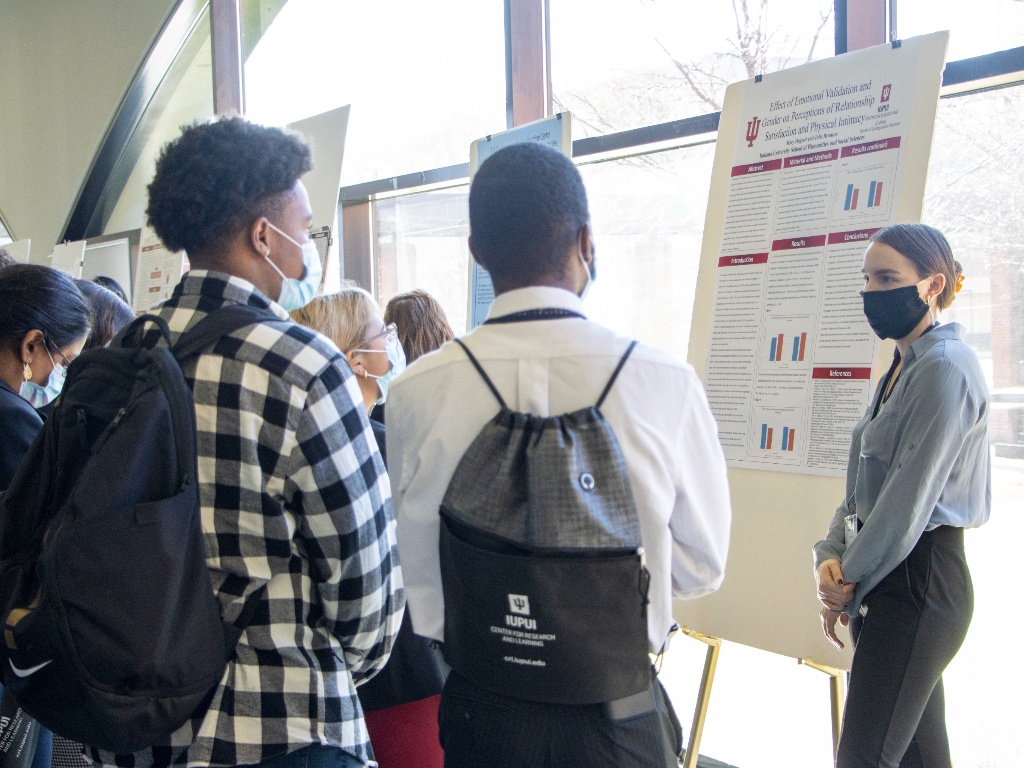 Students explore a research poster presentation